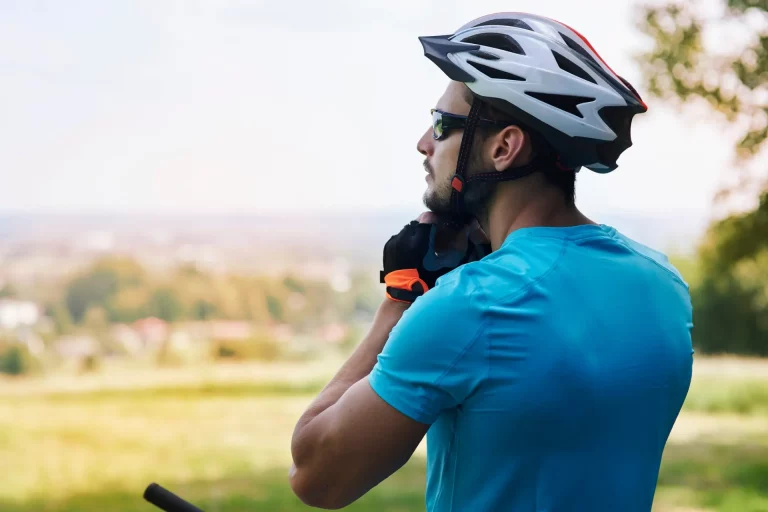 Healthy man cycling outdoors, representing performance, vitality and personalised health optimisation for men.